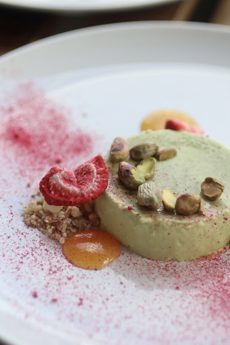 A plated dessert finished with Origo freeze-dried raspberry powder