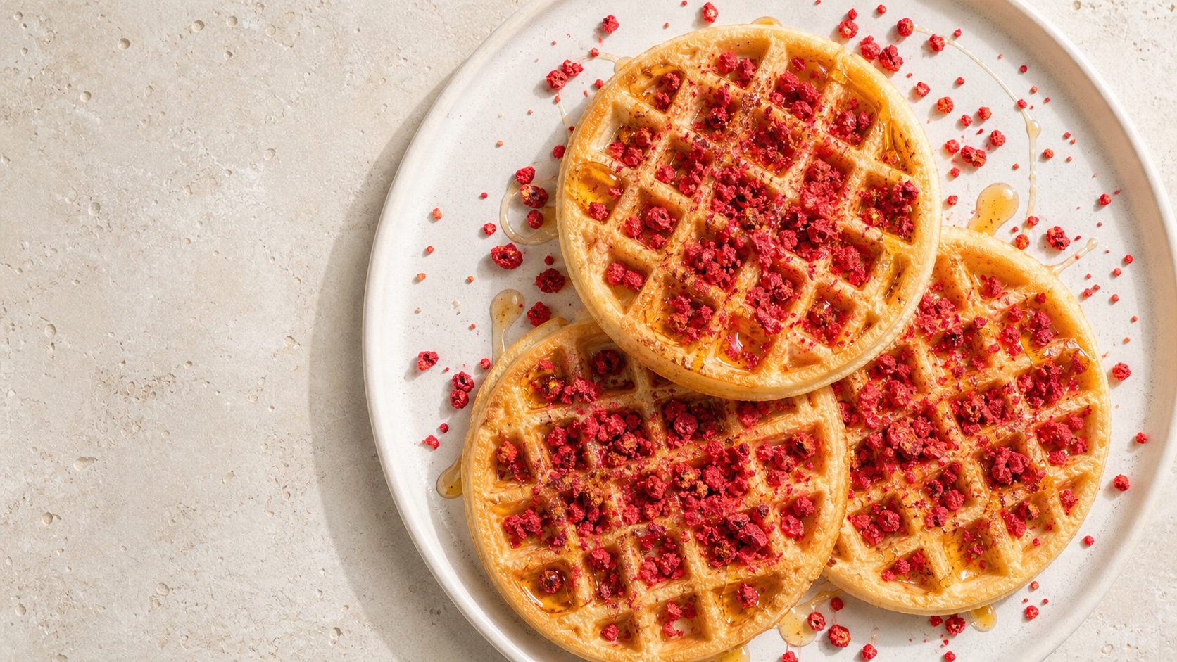 Waffles finished with Origo freeze-dried raspberry crumb and syrup